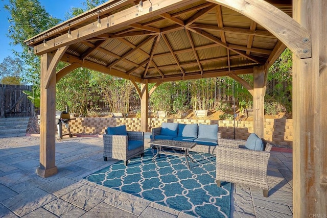 view of patio with a gazebo, an outdoor hangout area, and a grill