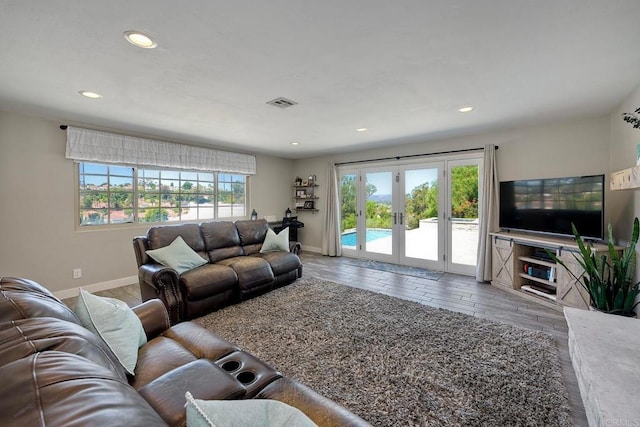 living room with plenty of natural light and french doors