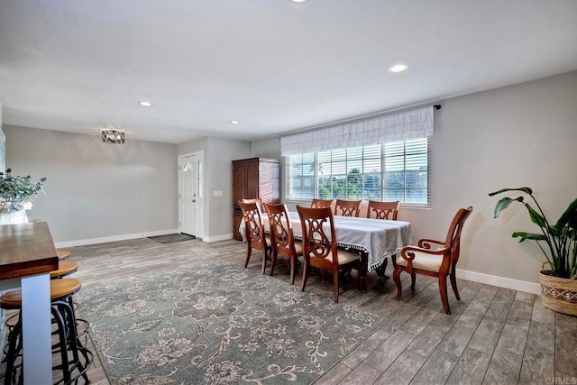 dining space featuring hardwood / wood-style floors