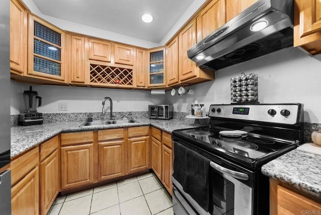 kitchen featuring light stone countertops, sink, electric stove, light tile patterned floors, and range hood