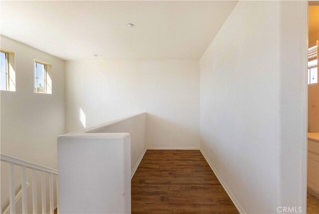 corridor with dark hardwood / wood-style floors