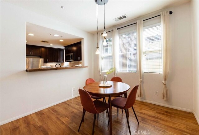 dining space featuring hardwood / wood-style floors