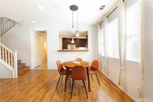 dining area with light wood-type flooring