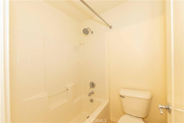 bathroom with shower / bath combination and toilet