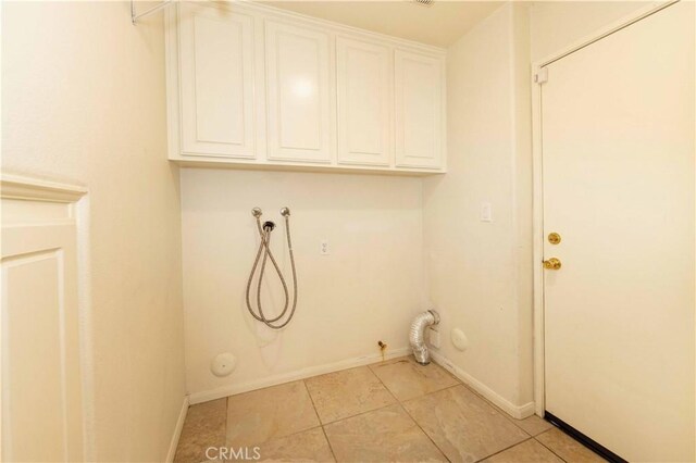 laundry area featuring washer hookup, hookup for a gas dryer, cabinets, and light tile patterned floors