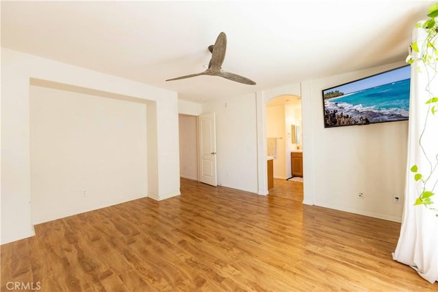 spare room featuring ceiling fan and light wood-type flooring