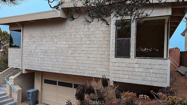 view of property exterior featuring a garage