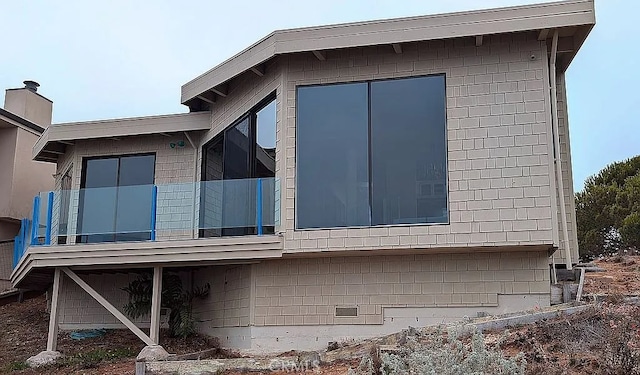 view of home's exterior featuring a balcony