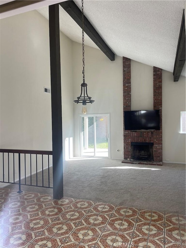 unfurnished living room featuring beam ceiling, high vaulted ceiling, carpet, a textured ceiling, and a brick fireplace