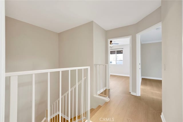 corridor with light hardwood / wood-style flooring