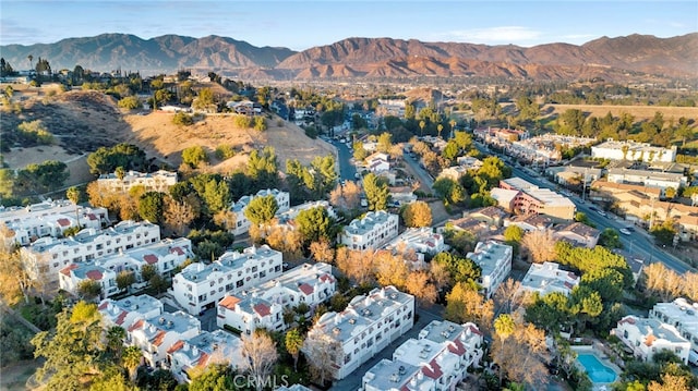 birds eye view of property with a mountain view