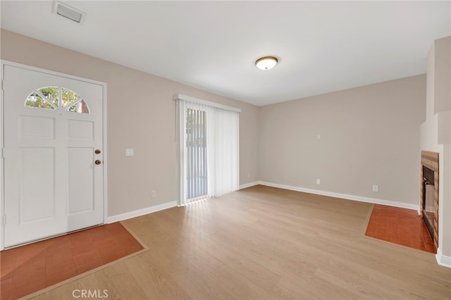 foyer with light hardwood / wood-style flooring