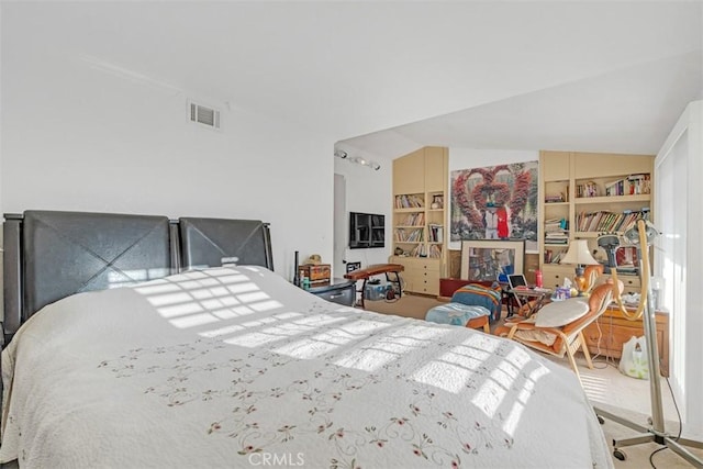 bedroom with carpet flooring and vaulted ceiling