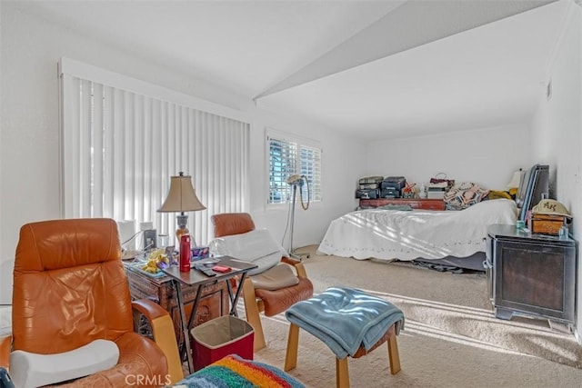 carpeted bedroom featuring vaulted ceiling