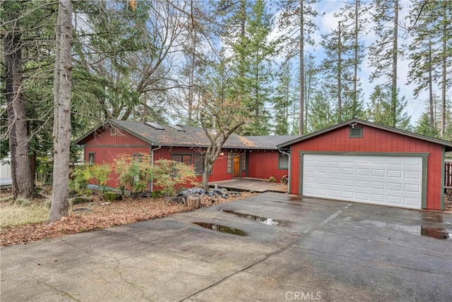 ranch-style house featuring a garage