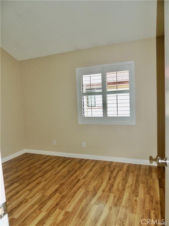 unfurnished room featuring light hardwood / wood-style floors