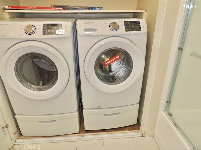 laundry area featuring washing machine and dryer