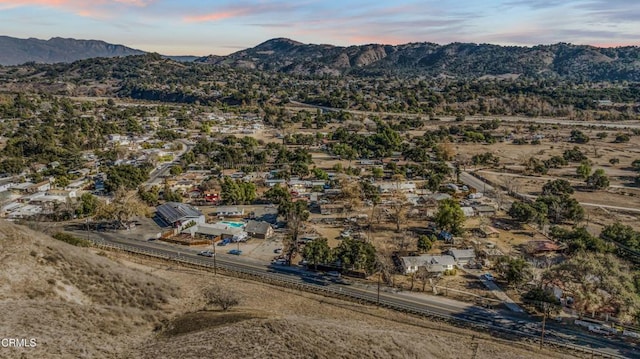 aerial view at dusk with a mountain view