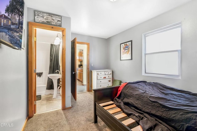 carpeted bedroom with connected bathroom