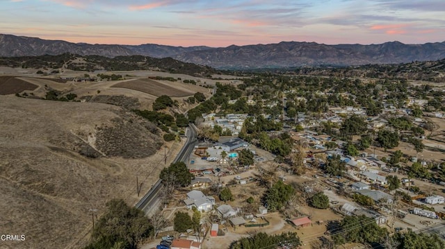 aerial view at dusk with a mountain view