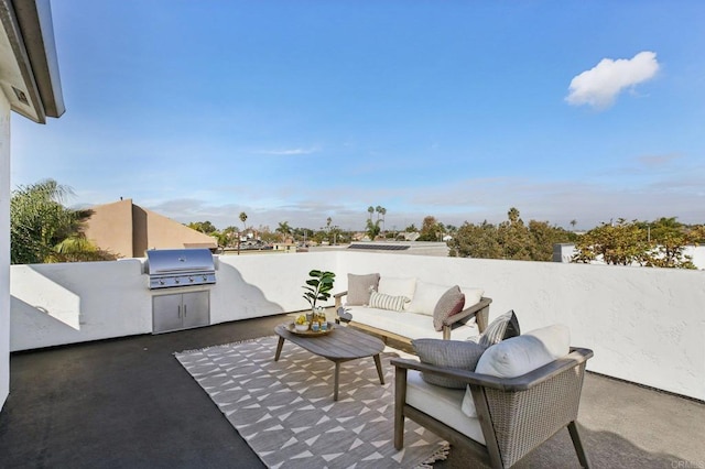 view of patio with outdoor lounge area, an outdoor kitchen, and area for grilling