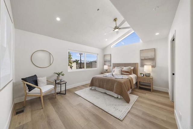 bedroom featuring ceiling fan, light hardwood / wood-style floors, and high vaulted ceiling