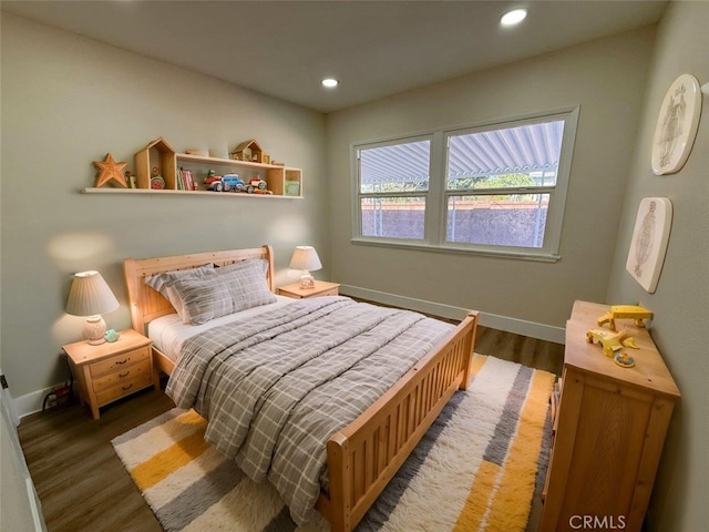 bedroom featuring dark hardwood / wood-style floors