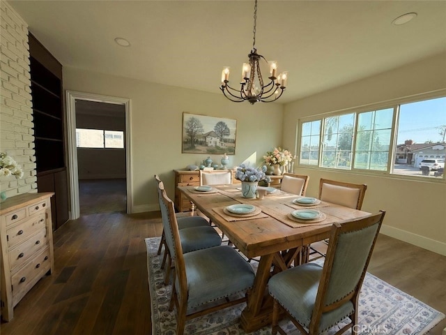 dining space featuring a chandelier and dark hardwood / wood-style floors