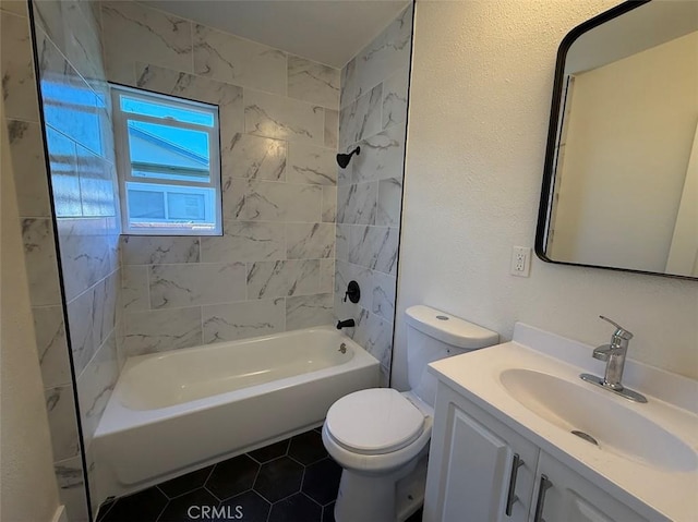 full bathroom with vanity, toilet, tile patterned floors, and tiled shower / bath