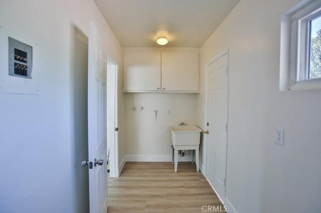 laundry area featuring light hardwood / wood-style floors