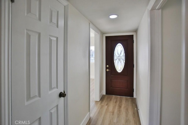 entryway with light hardwood / wood-style flooring