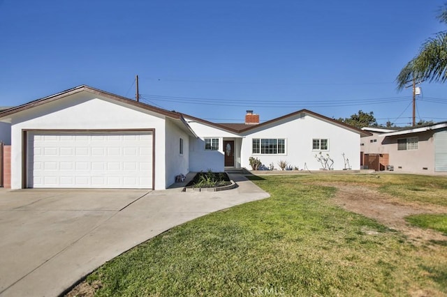 ranch-style house featuring a front yard and a garage