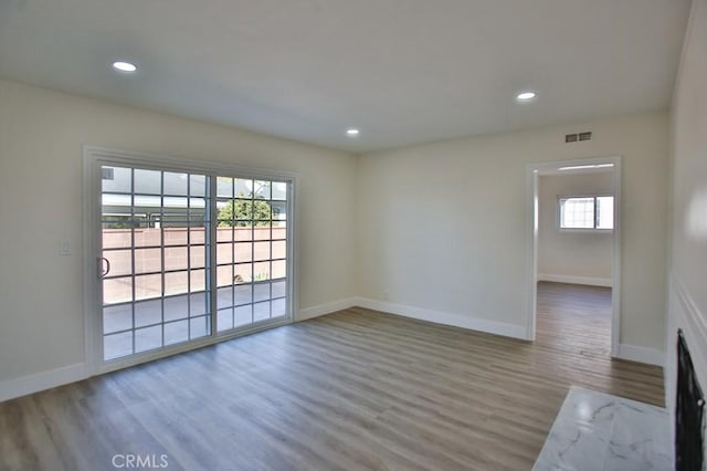 empty room featuring hardwood / wood-style flooring