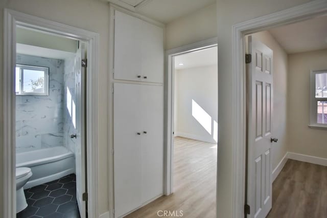 corridor featuring hardwood / wood-style flooring