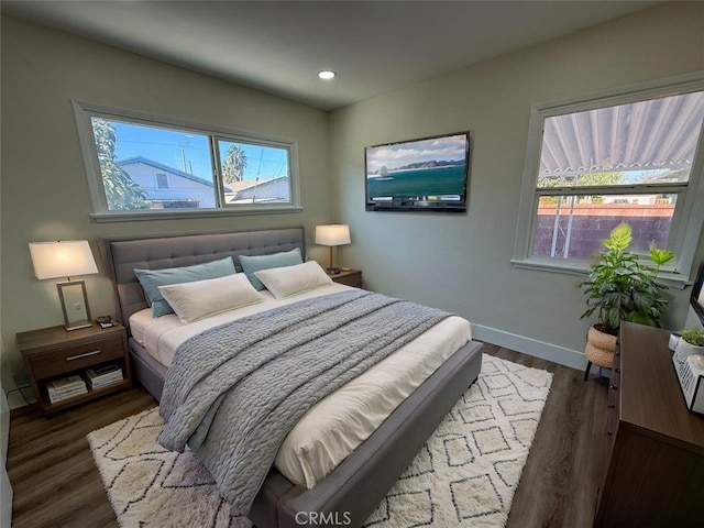 bedroom featuring dark wood-type flooring