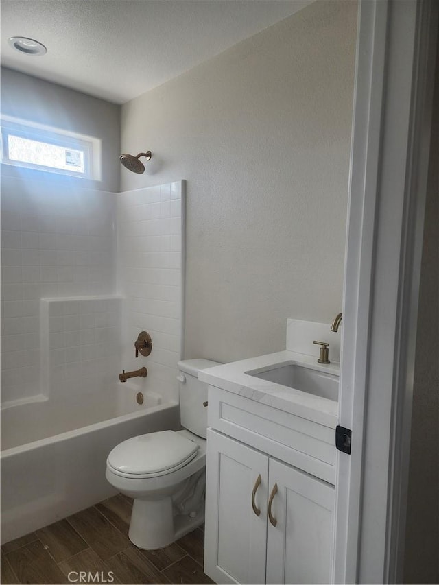 full bathroom with shower / tub combination, toilet, and vanity