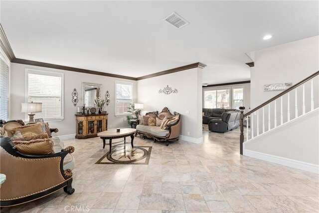 living room with ornamental molding