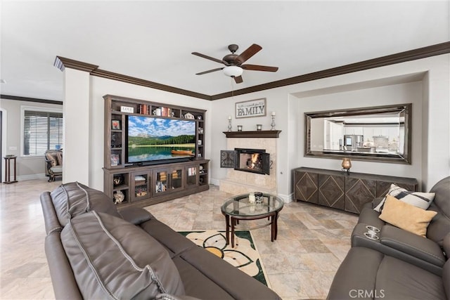 living room featuring ceiling fan and crown molding