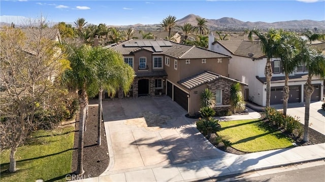 birds eye view of property with a mountain view