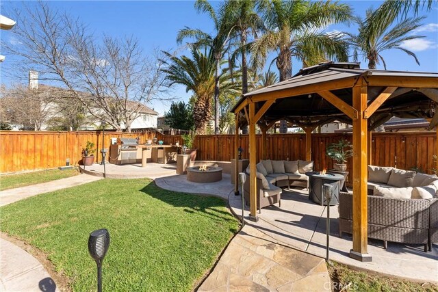 view of yard with a gazebo, a patio area, and an outdoor living space with a fire pit