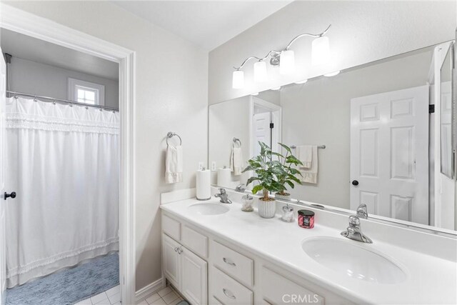 bathroom featuring vanity and tile patterned flooring