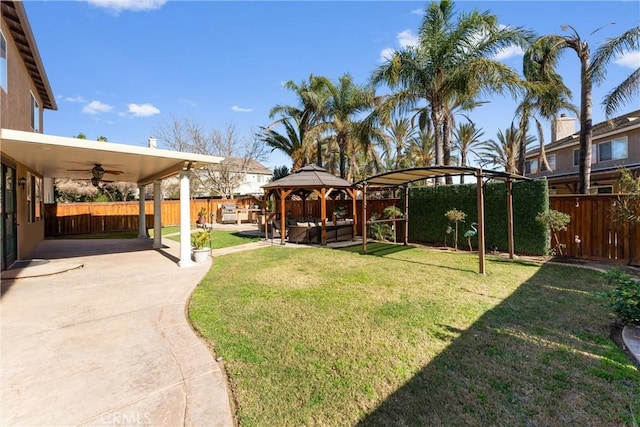 view of yard with a gazebo, a patio area, and ceiling fan