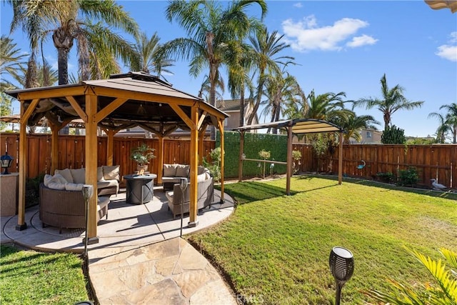 view of yard featuring an outdoor hangout area, a patio area, and a gazebo