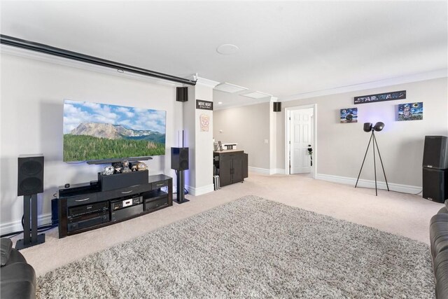 carpeted living room with ornamental molding