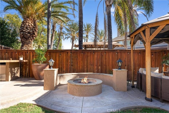 view of patio / terrace with an outdoor fire pit