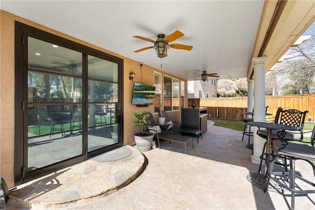 view of patio / terrace featuring ceiling fan