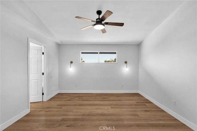 unfurnished room featuring ceiling fan and hardwood / wood-style flooring