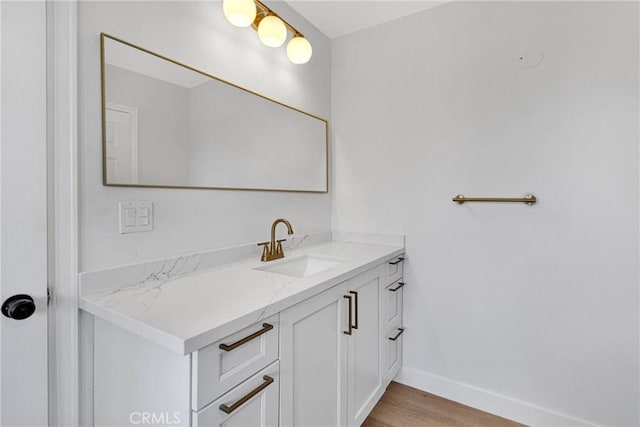 bathroom featuring vanity and hardwood / wood-style floors