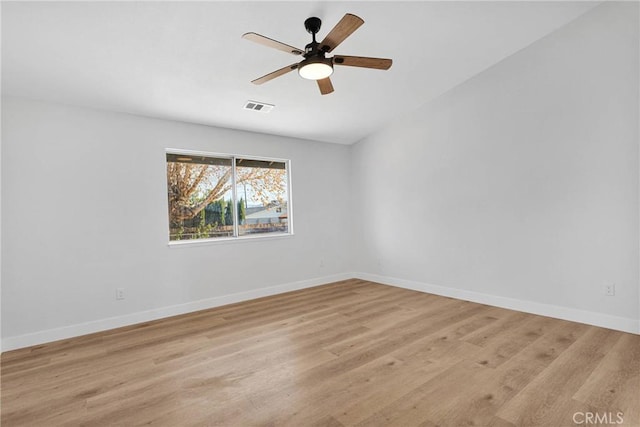 empty room featuring light wood-type flooring and ceiling fan