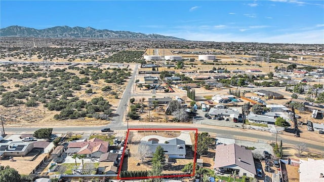 birds eye view of property featuring a mountain view